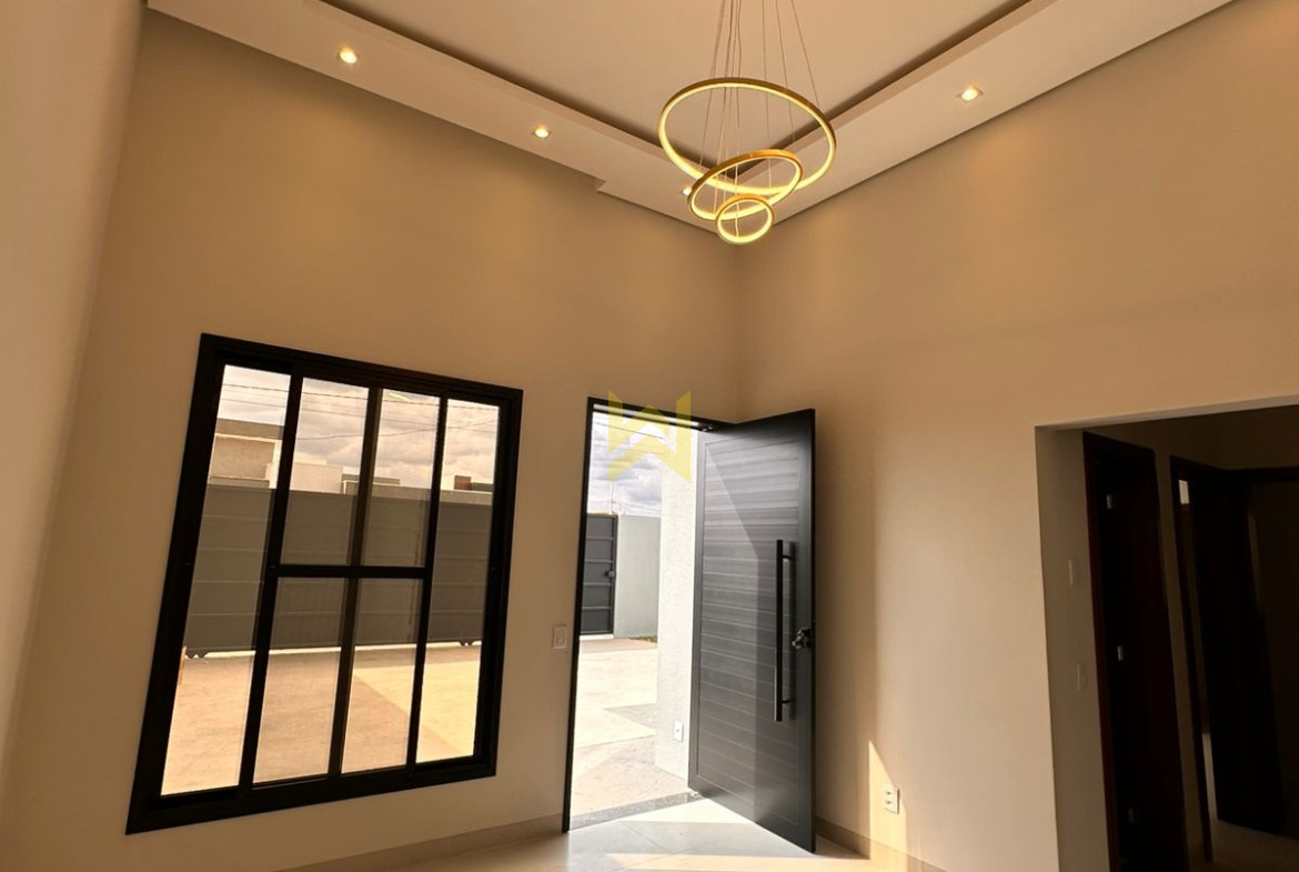 Sala ampla e moderna em imóvel à venda em Vilhena - RO, com piso porcelanato, teto rebaixado e iluminação natural — Wender Imóveis.